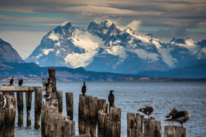 Puerto Natales pier with mountains in the background