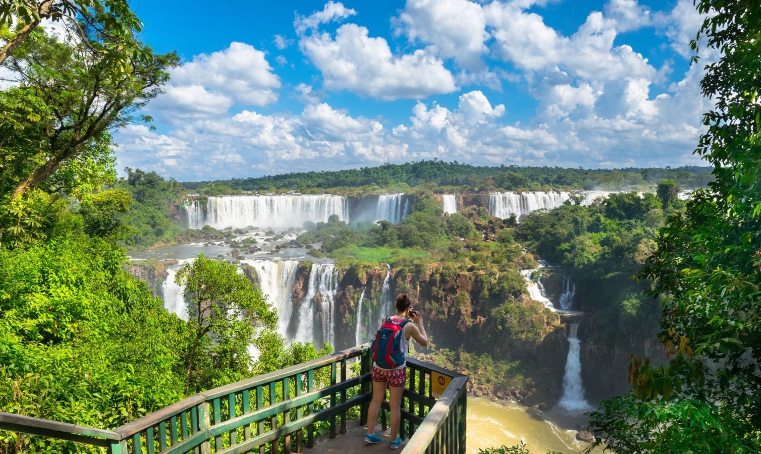 Woman backpack travel iguazu falls argentina