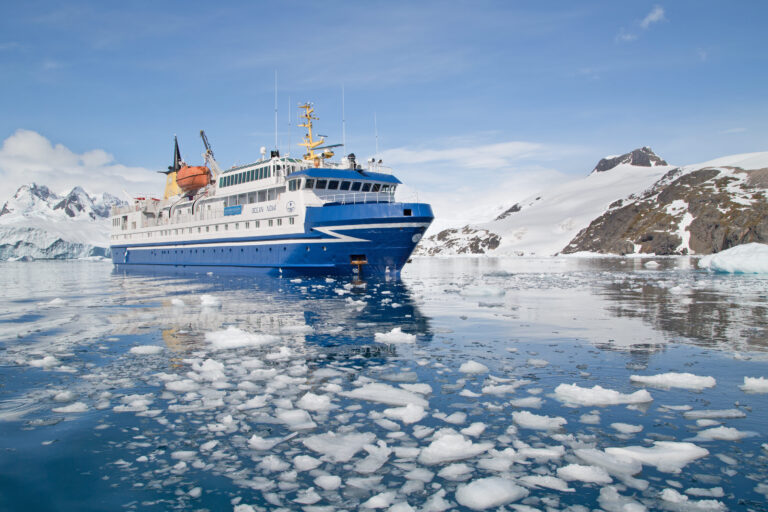 Ship sailing through the ice in Antarctica