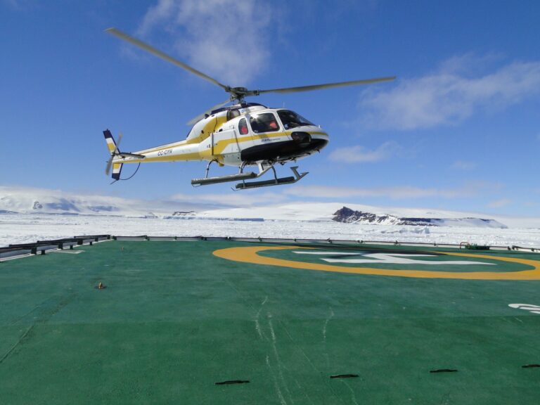 Flying over the Antarctic in an helicopter during the cruise adventure